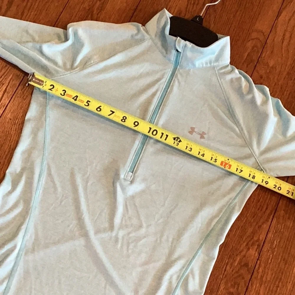 Under Armour light blue, lightweight, fitted quarter zip pullover. Women’s MED